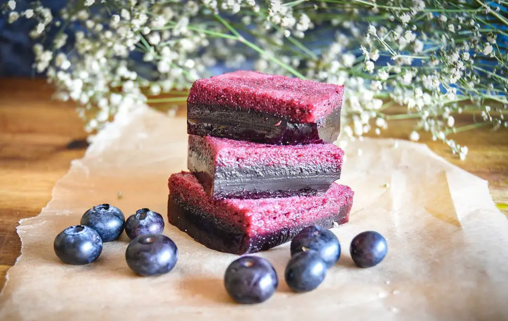 blueberry jello squares stacked on one another