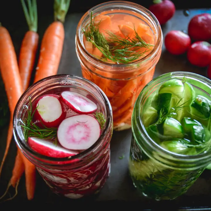 Easy Fermented Vegetables in jars with radishes, cucumbers and carrots and dill