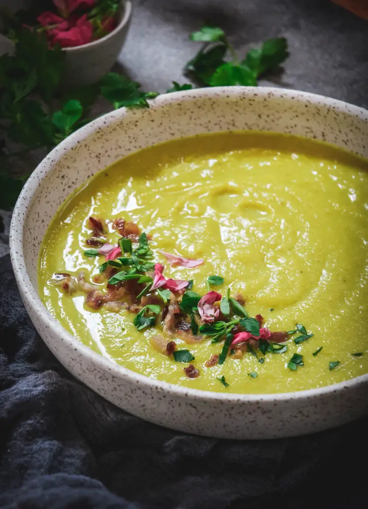 golden cauliflower soup up close with bacon bits 