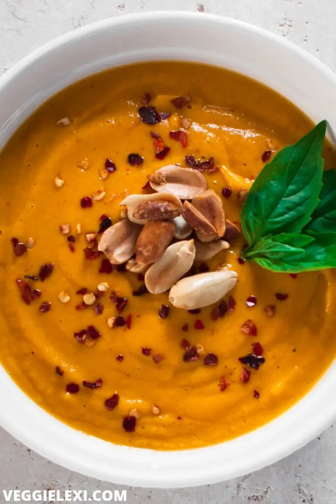 Sweet potato soup with peanuts in bowl