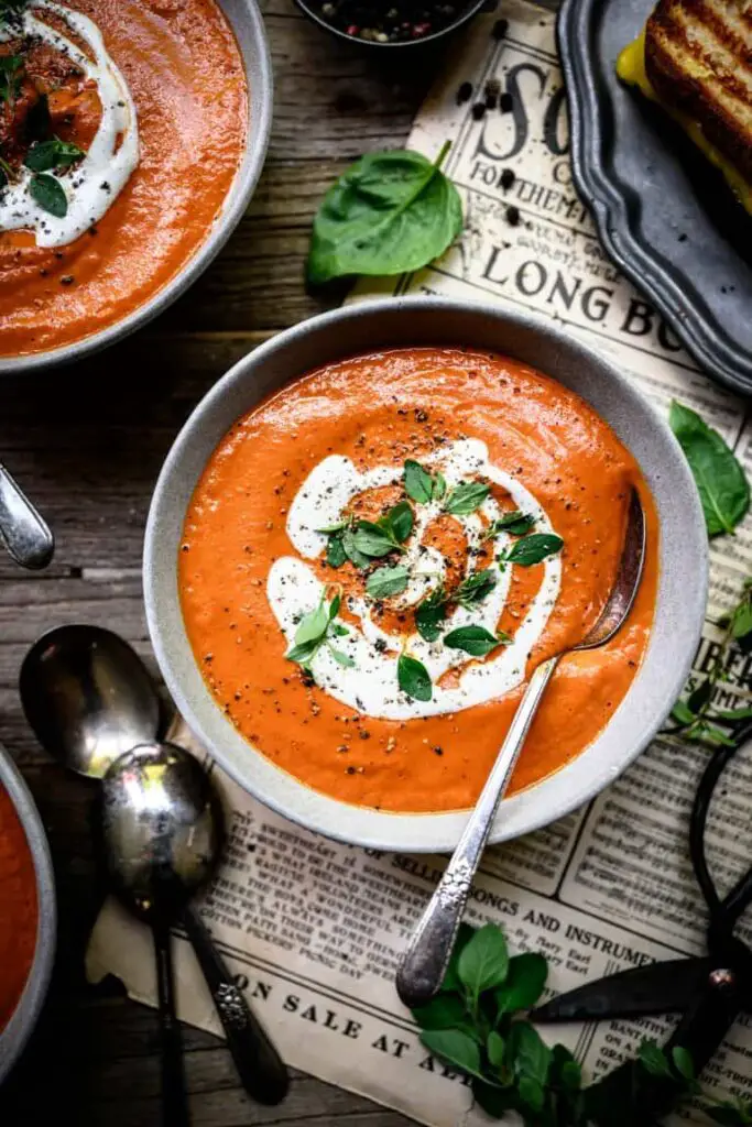 tomato soup in bowl with spoons