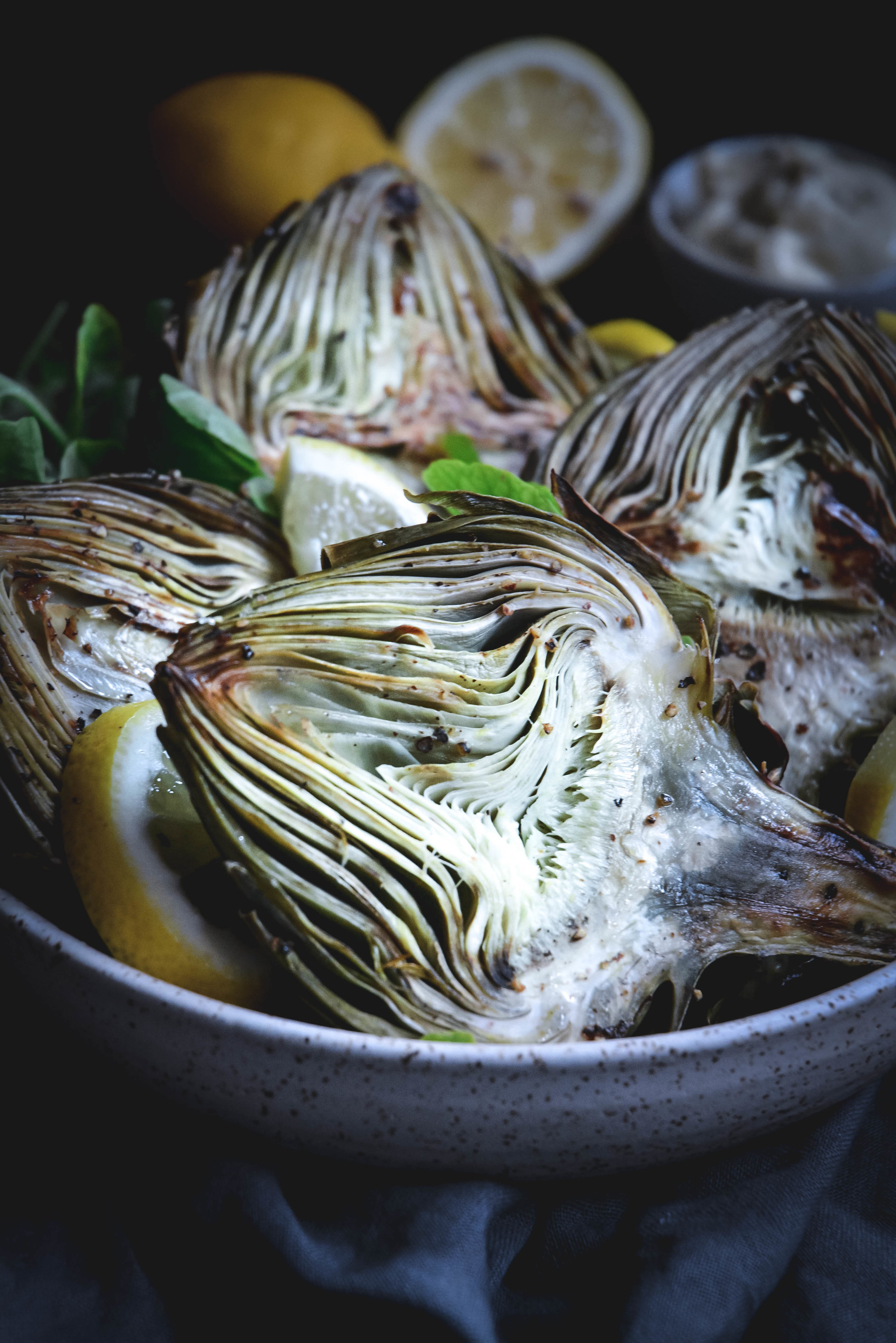 roasted artichoke halves in bowl