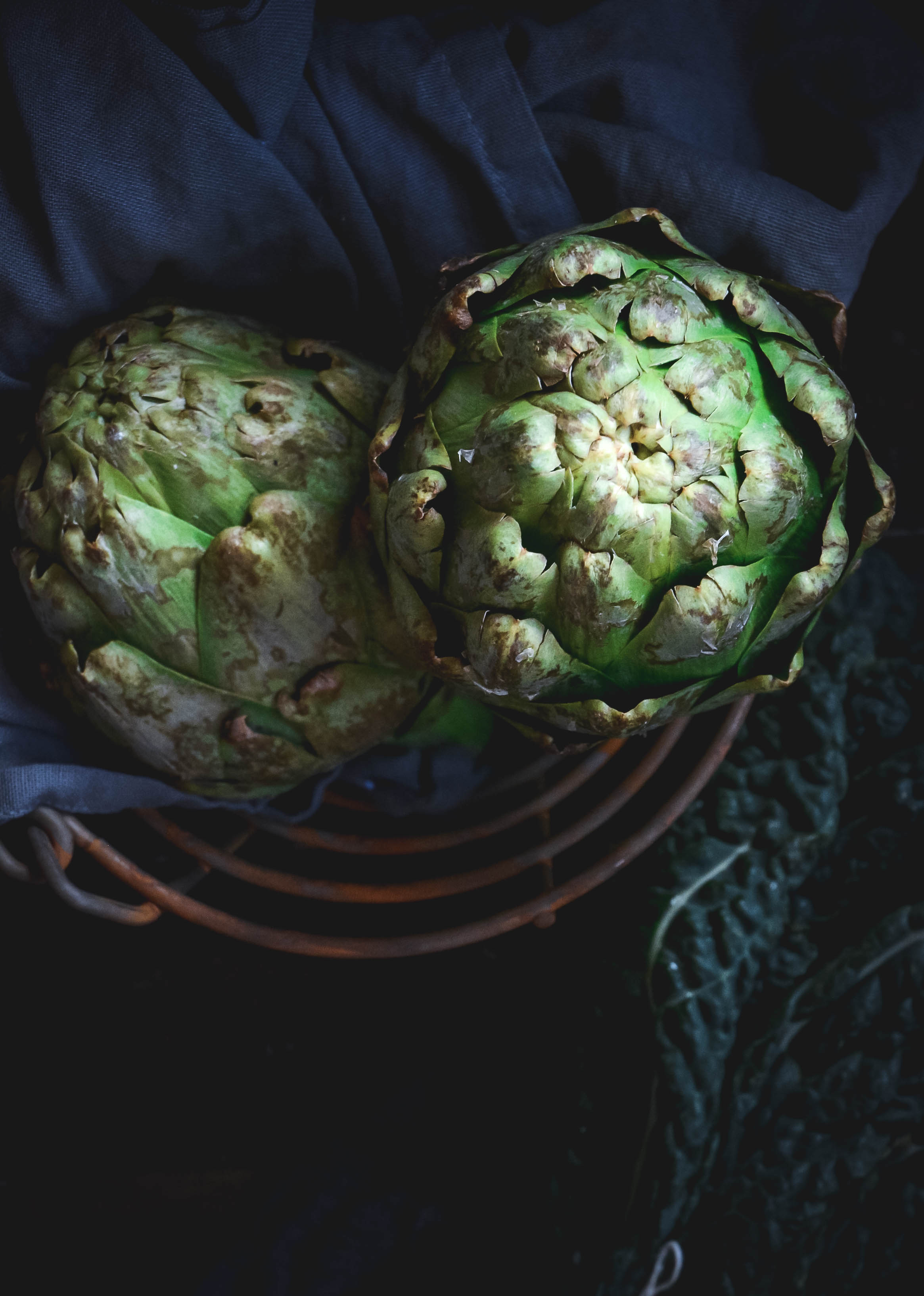 artichokes in basket with napkin