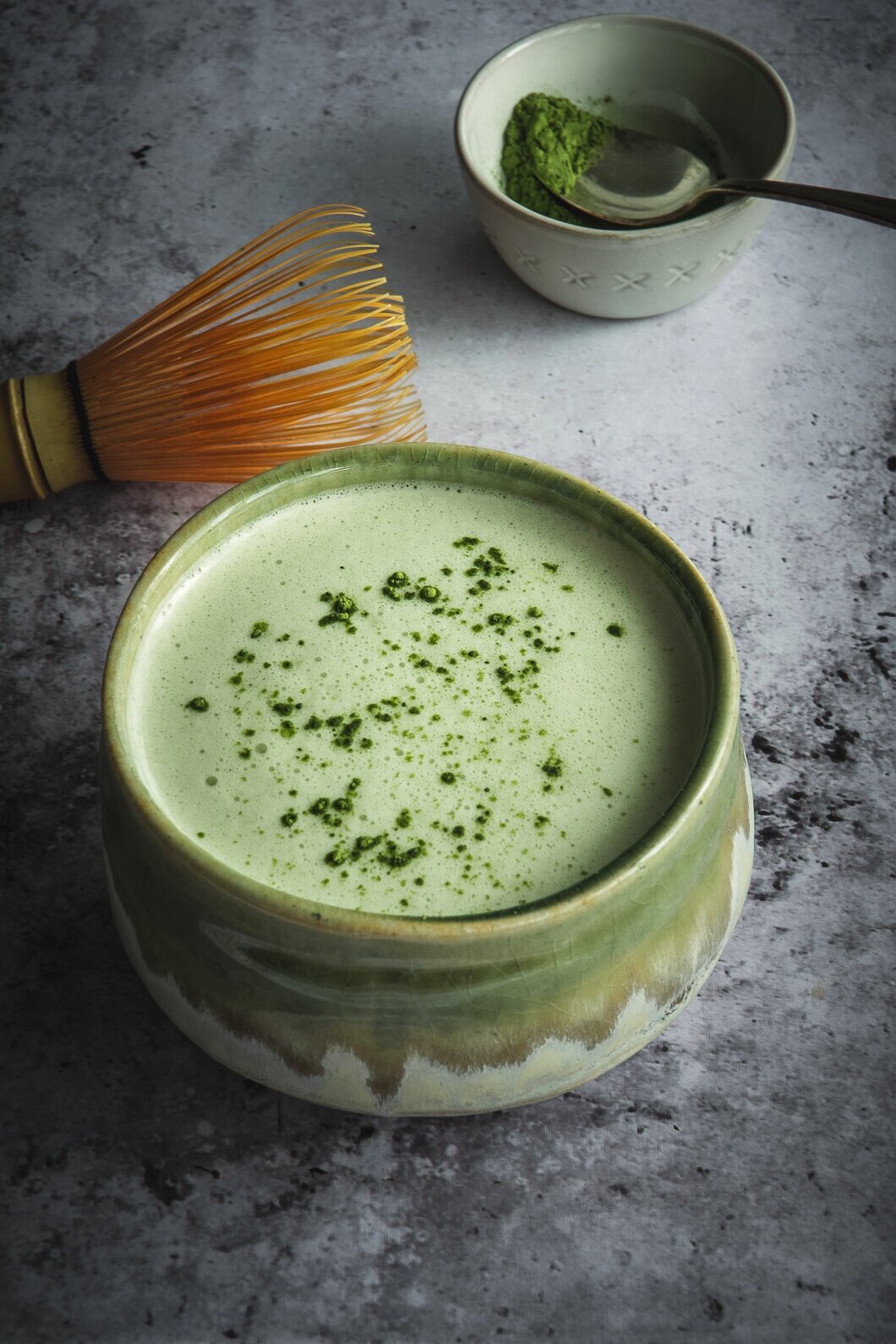 Matcha and moringa latte in cup