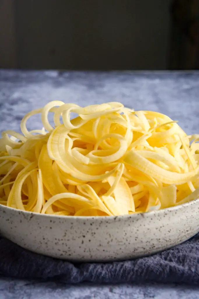 These quick Paleo “Peanut” Noodles are made from rutabaga and are surprisingly similar to actual noodles. They work beautifully with the cashew and tahini sauce to create a creamy vegan and paleo recipe. Check out this 10 minute recipe! #calmeats #vegan #paleo #whole30 #paleopeanutnoodles #peanutnoodles #paleorecipes #grainfreenoodles #glutenfree #dairyfree #rutabaganoodles #tahinisauce