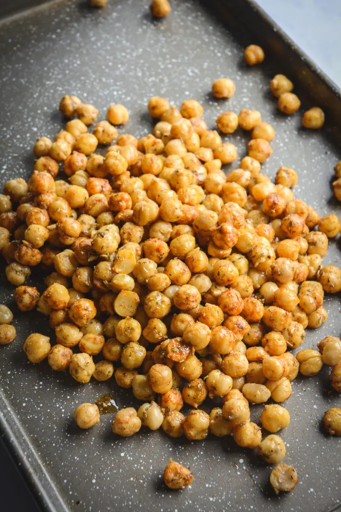 Chickpeas with olive oil and spices on tray