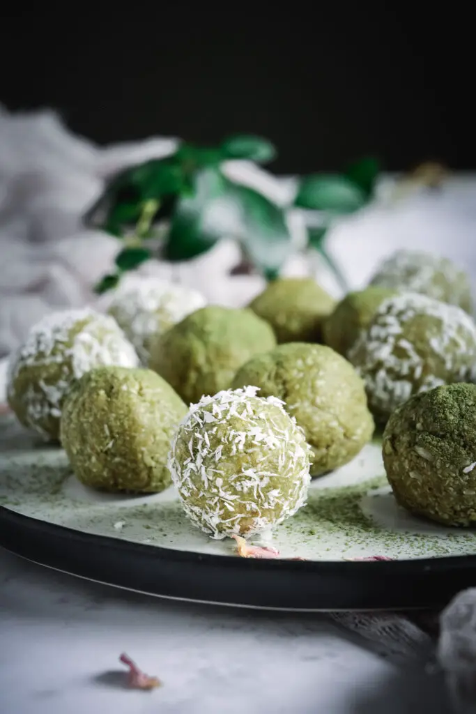 match balls covered with matcha and shredded coconut 
