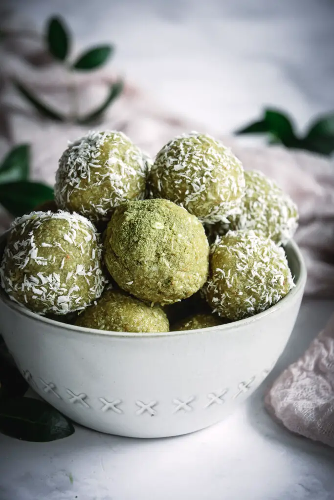 Coconut Cashew Matcha Honey Energy Bites in bowl