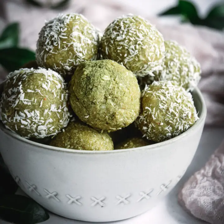 Coconut Cashew Matcha Energy Bites in white bowl