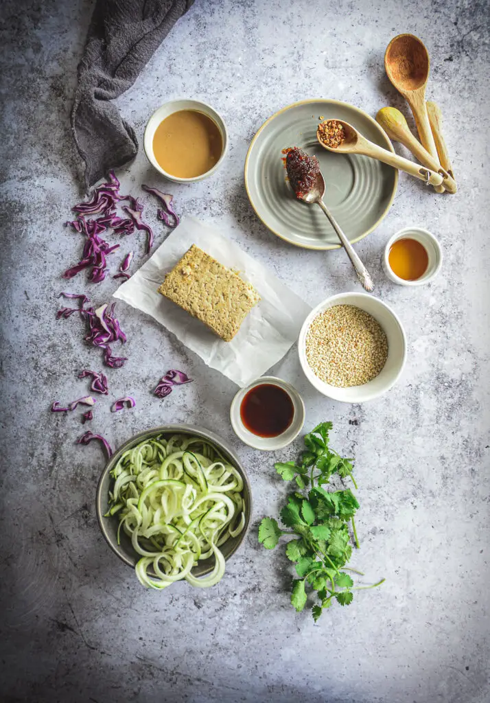 Ingredients for Thai peanut zoodles on table with napkin