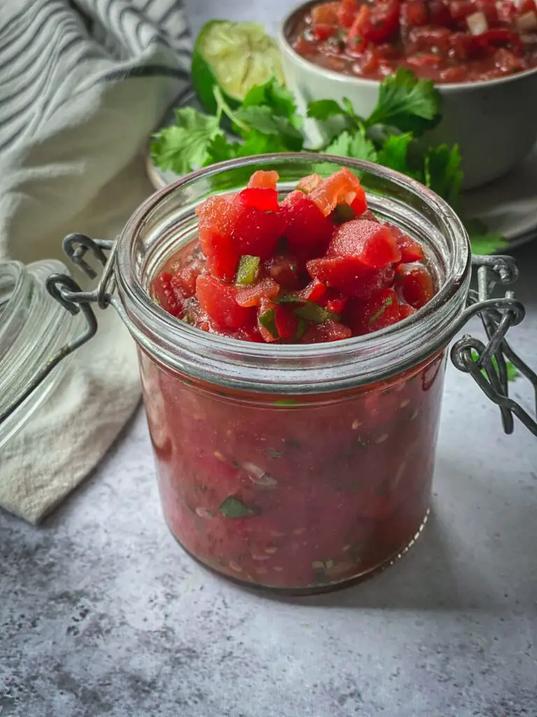 Homemade salsa in jar with cilantro