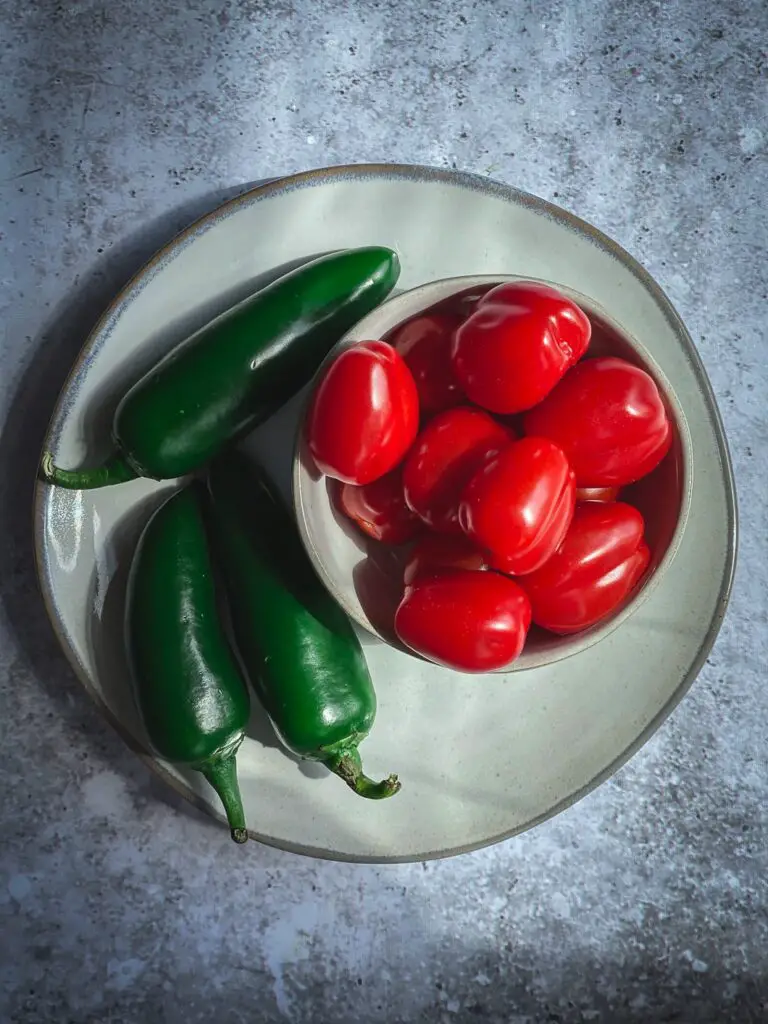 tomatoes and jalapenos on plate