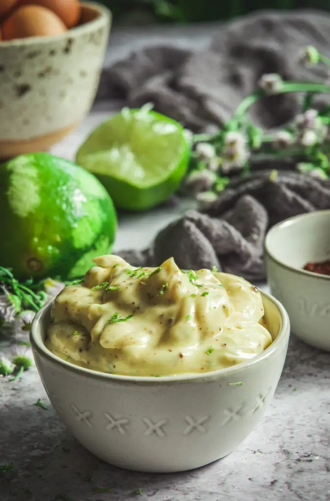 Chipotle Mayo in bowl sprinkled with lime zest.