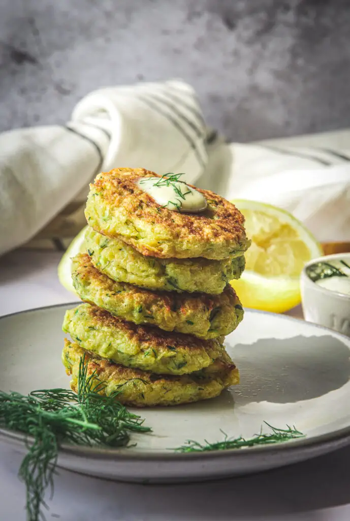 Zucchini Rutabaga Fritters on plate with dill