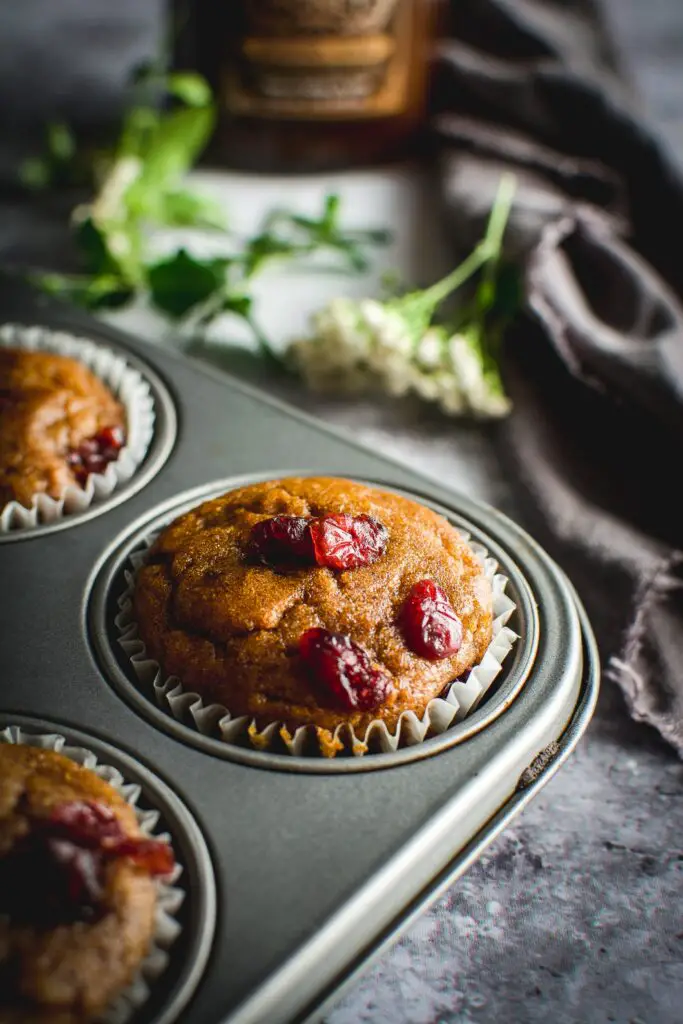 Healthy Grain-Free Cranberry Pumpkin Spice Muffins in tin up close