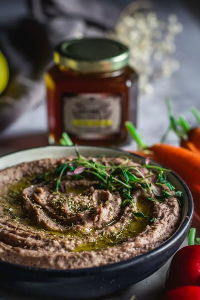 adzuki bean hummus with carrots and thyme in background