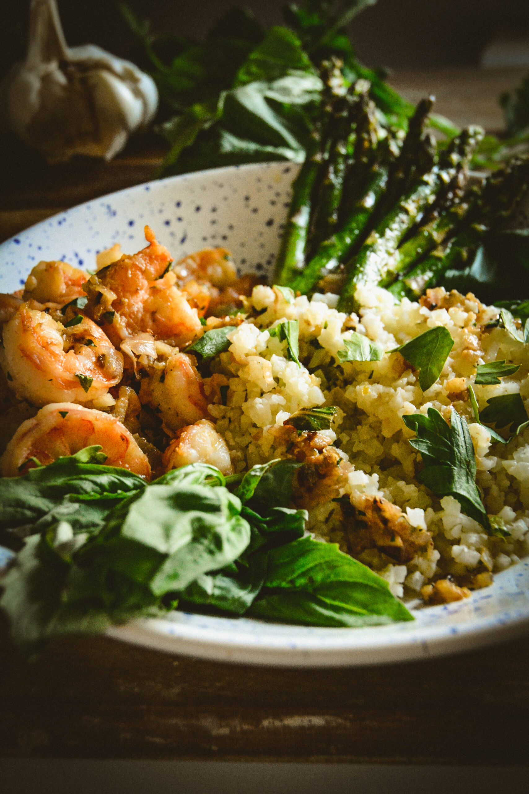 shrimp cauliflower rice and asparagus on plate