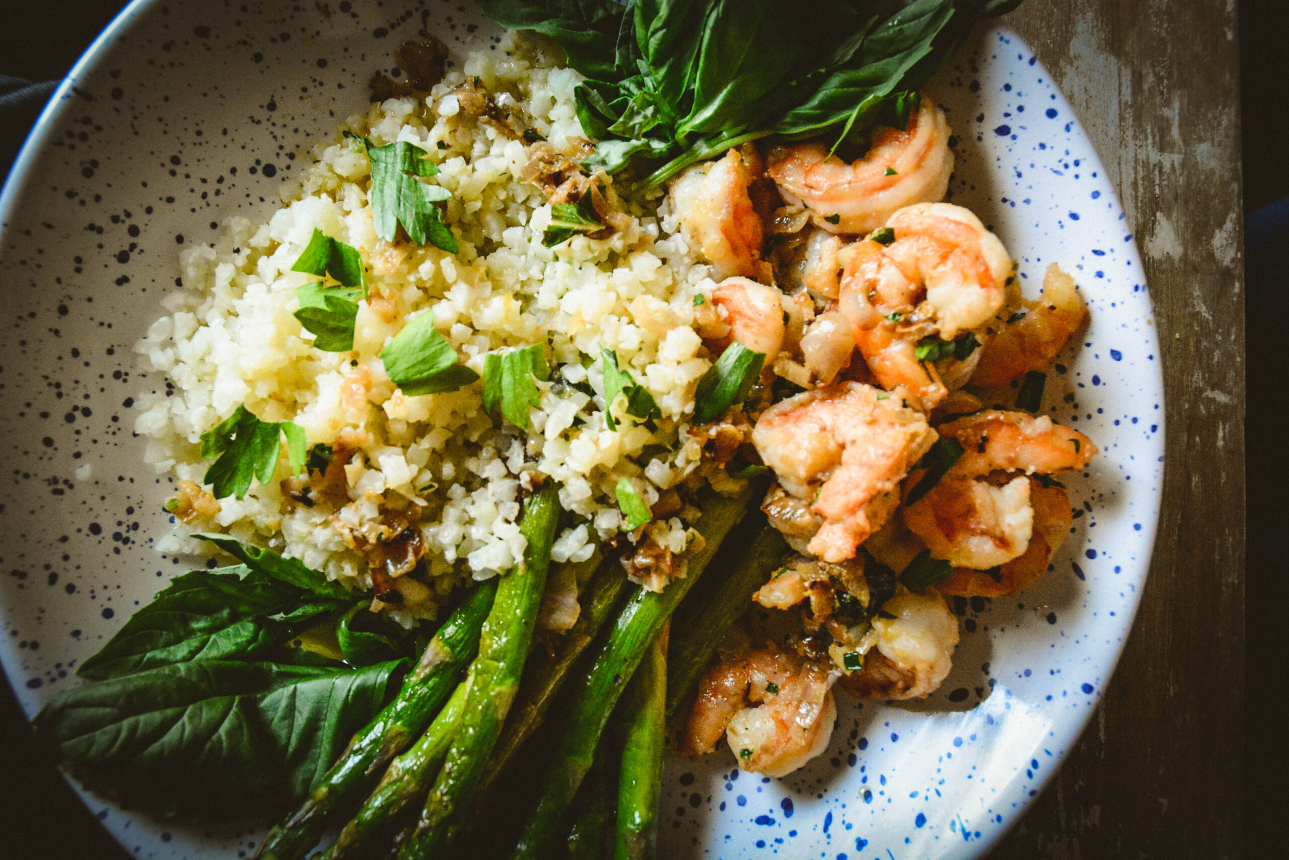 shrimp cauliflower rice and asparagus on plate