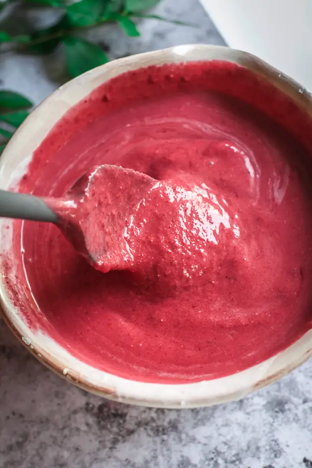 red mixture in bowl with spatula