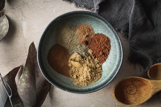 various spices in a blue bowl