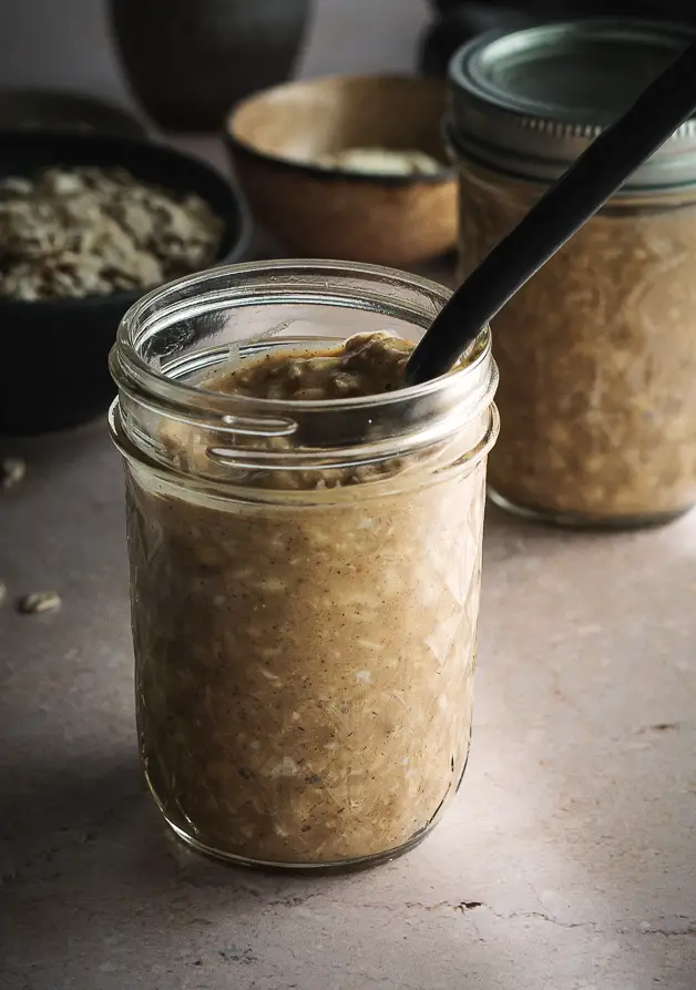 pumpkin oatmeal in a glass jar with a spoon