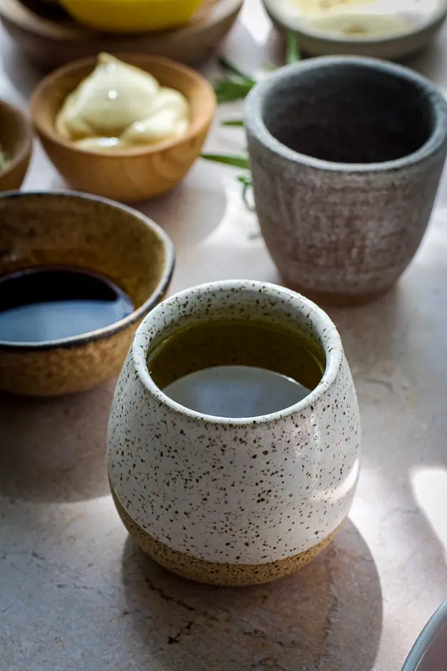 small cups with soy sauce and olive oil