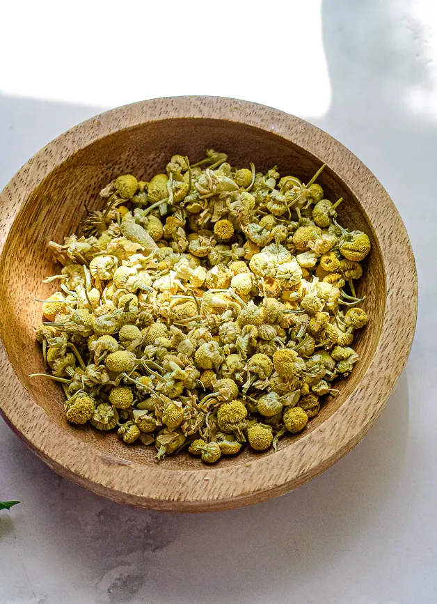 chamomile flowers in a small bowl