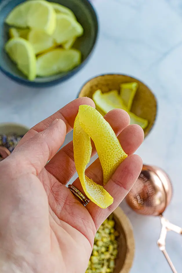 hand holding lemon rind
