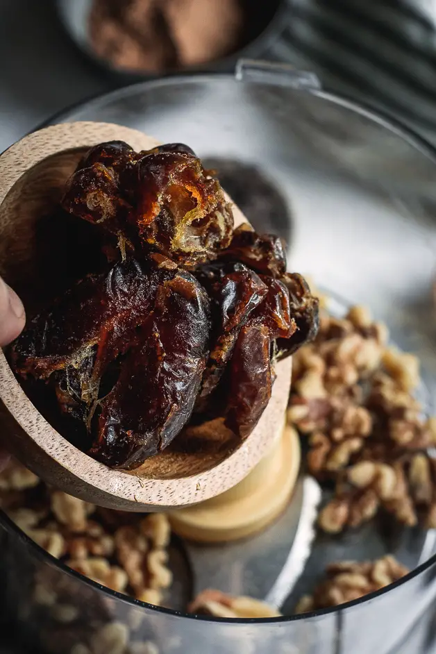 dates being put into a food procesor