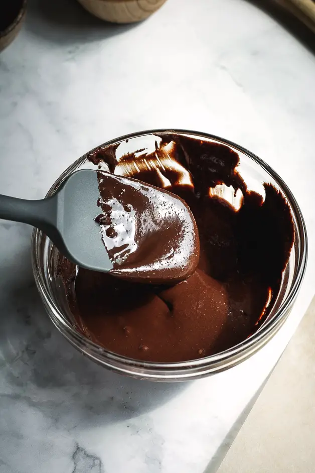 milted chocolate in a small bowl with a spatula