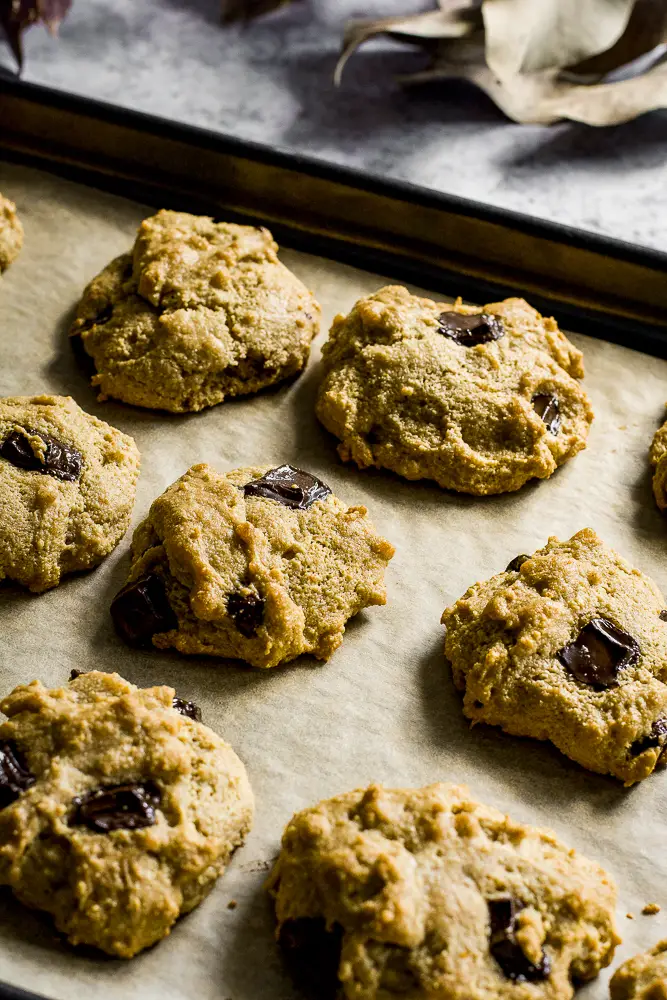 cookies on a tray with chocolate chunks