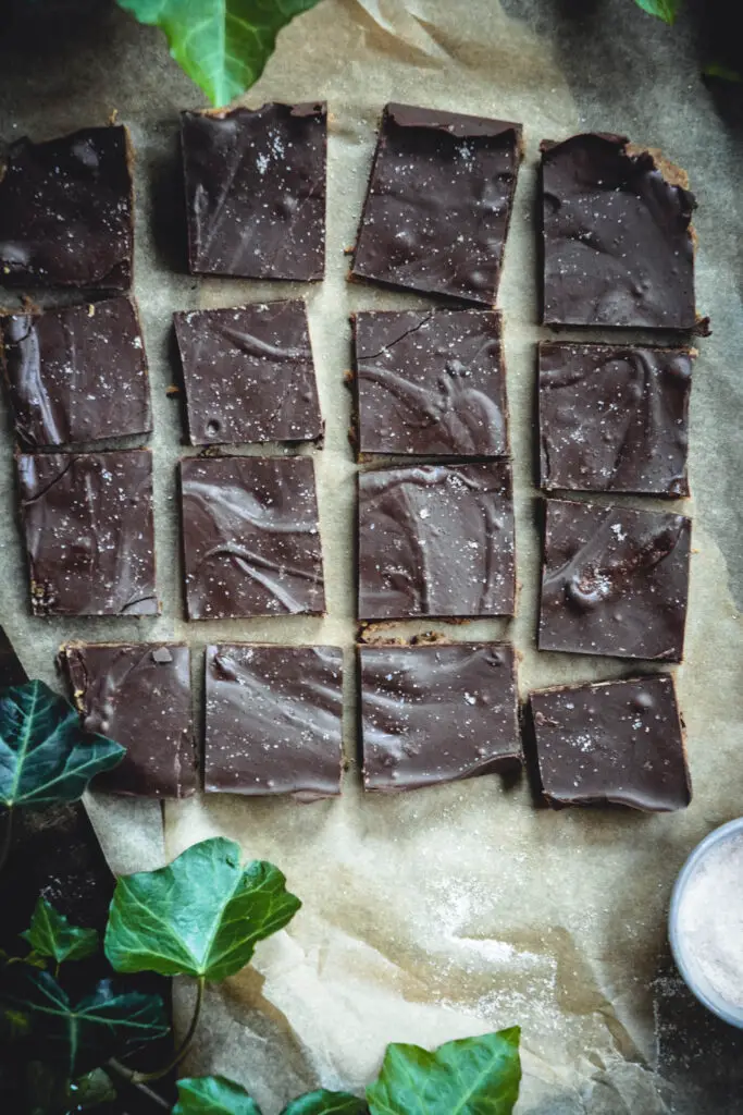chocolate bars cut up on parchment paper