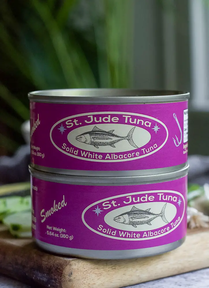 2 cans of pink label tuna stacked